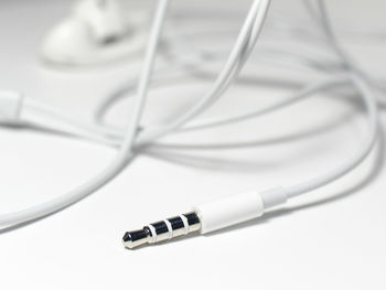 Close-up of in-ear headphones on white background