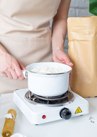 Midsection of man preparing food on table