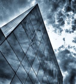 Low angle view of building against cloudy sky