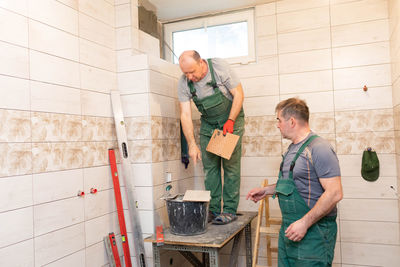 Side view of man working in workshop