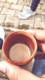 Person holding coffee cup