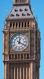 Low angle view of clock tower against sky