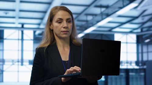Portrait of young woman using digital tablet