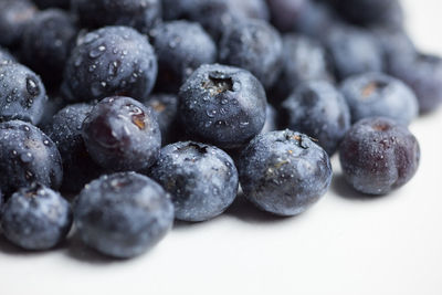 Close-up of blueberries against white background