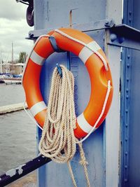 Rope tied to fishing boat at harbor