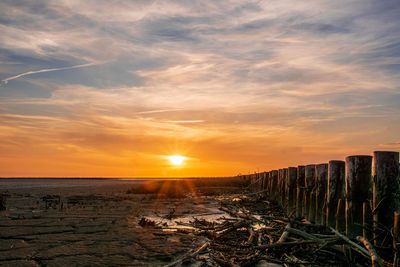 Scenic view of sunset over land