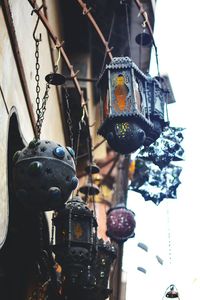 Low angle view of lanterns hanging on metal