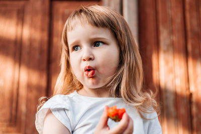 Portrait of cute girl against white