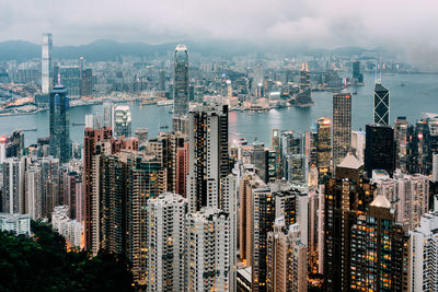 Aerial view of city and buildings against sky