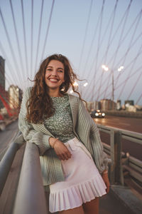 Portrait of smiling young woman outdoors