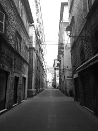 Street amidst residential buildings