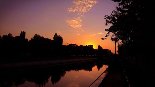 Scenic view of lake at sunset