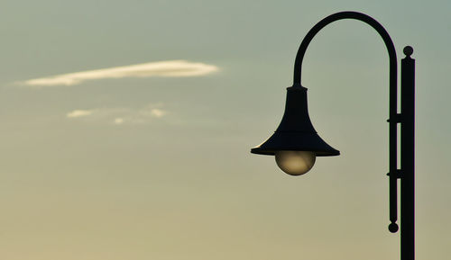 Low angle view of street light against sky