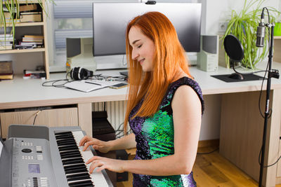 Young woman using phone at home