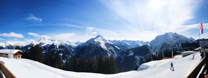 Panoramic view of snowcapped mountains against sky