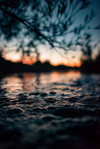 Scenic view of lake against sky at sunset