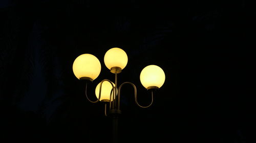 Low angle view of illuminated street light