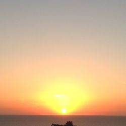 Scenic view of sea at sunset