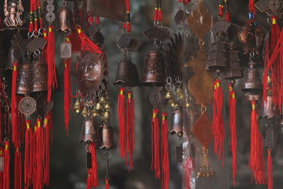 Close-up of decorations hanging at market stall