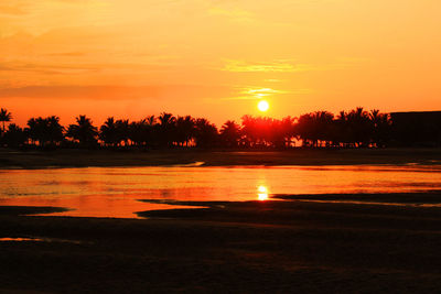 Scenic view of sunset over river