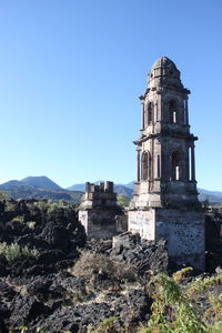 Historic building against clear blue sky