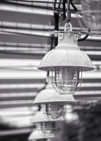 View of light bulb hanging from ceiling