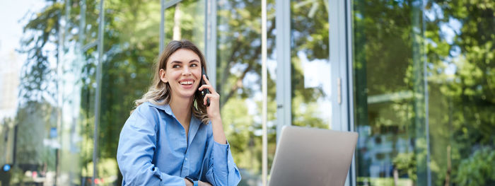 Young woman using mobile phone