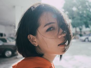 Portrait of young woman looking away