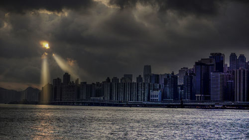 Panoramic view of sea and buildings against sky