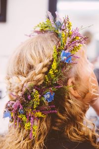 Rear view of girl with flowers