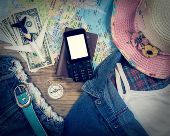 High angle view of person using mobile phone on table