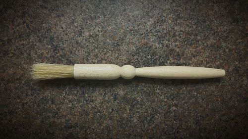 Close-up of wooden brush  on table