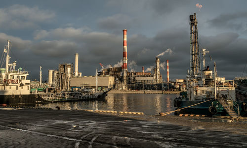 View of commercial dock against cloudy sky