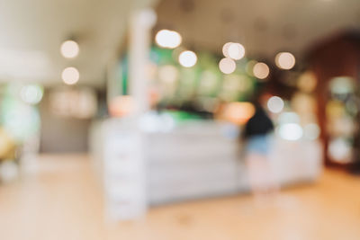 Defocused image of illuminated lights on table