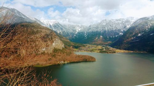 Scenic view of lake and mountains against sky