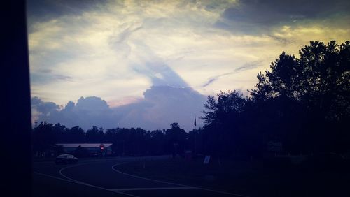 View of road against cloudy sky