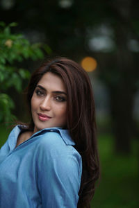 Portrait of young woman looking away