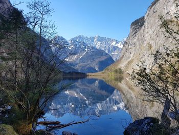 Scenic view of lake and mountains against sky