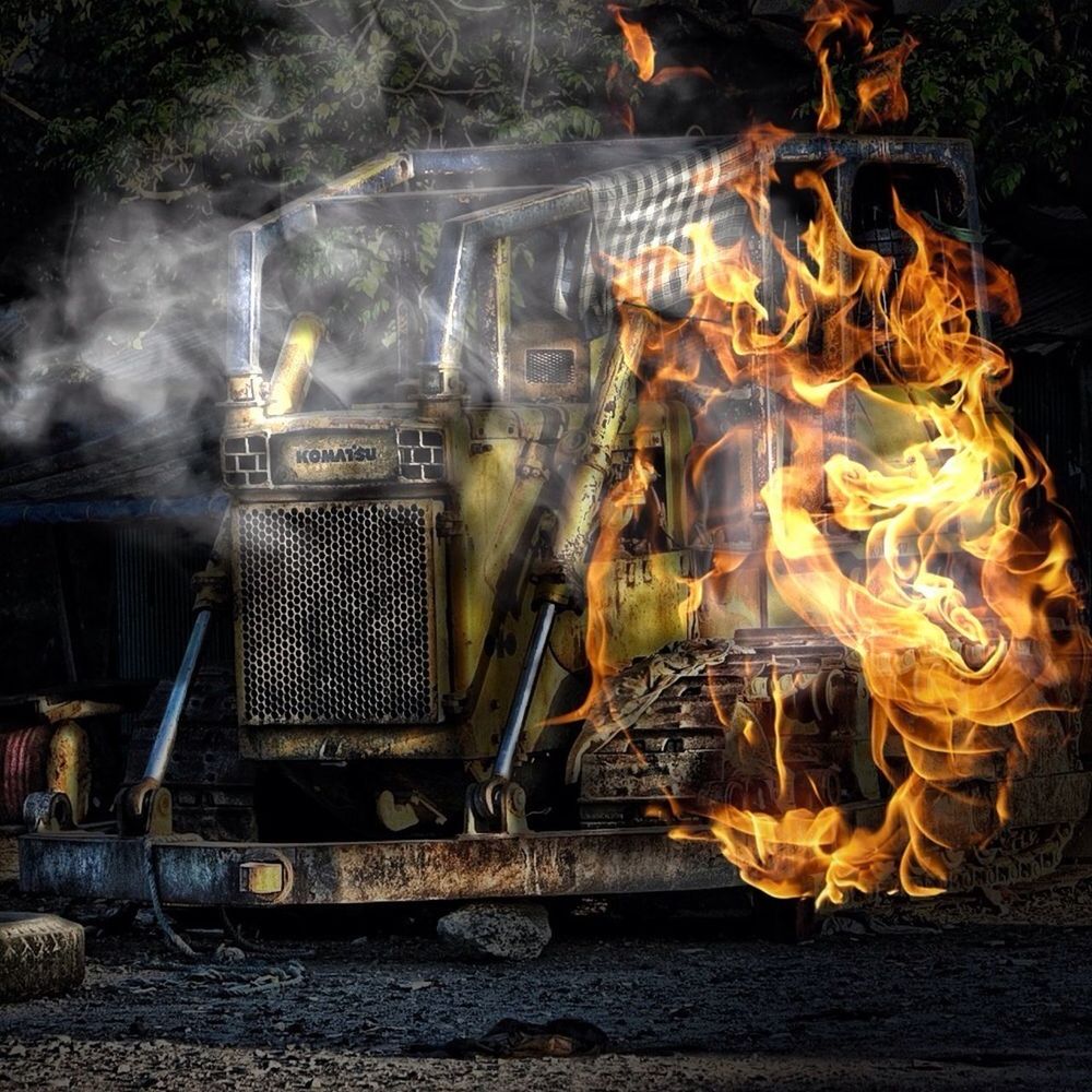 indoors, flame, fire - natural phenomenon, heat - temperature, burning, no people, abandoned, metal, still life, messy, smoke - physical structure, obsolete, day, wall - building feature, high angle view, damaged, industry, art and craft, container