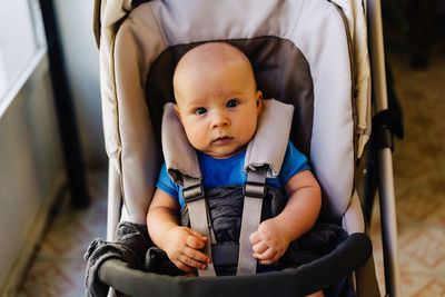 Baby in carriage looking at camera