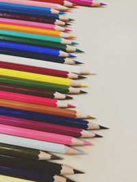 High angle view of multi colored pencils on table