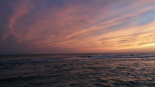 Scenic view of sea against sky at sunset