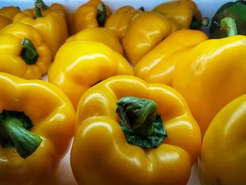 Full frame shot of yellow bell peppers for sale in market