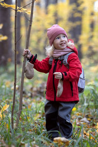 Portrait of cute girl standing outdoors