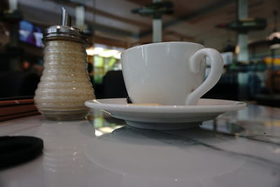 Close-up of coffee cup on table