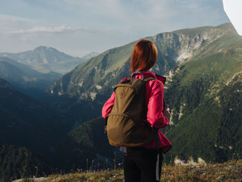 Rear view of man looking at mountains