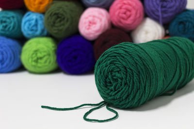 Close-up of colorful wools on table