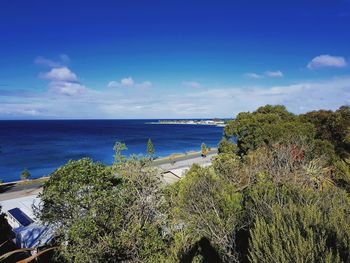 Scenic view of sea against blue sky