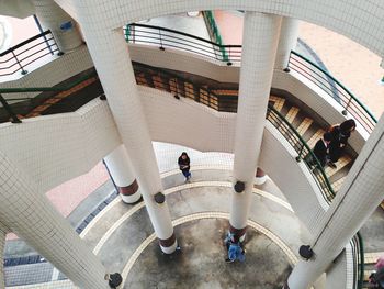 High angle view of people standing in modern building