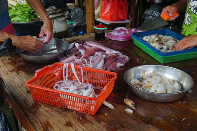 High angle view of man and fish for sale at market